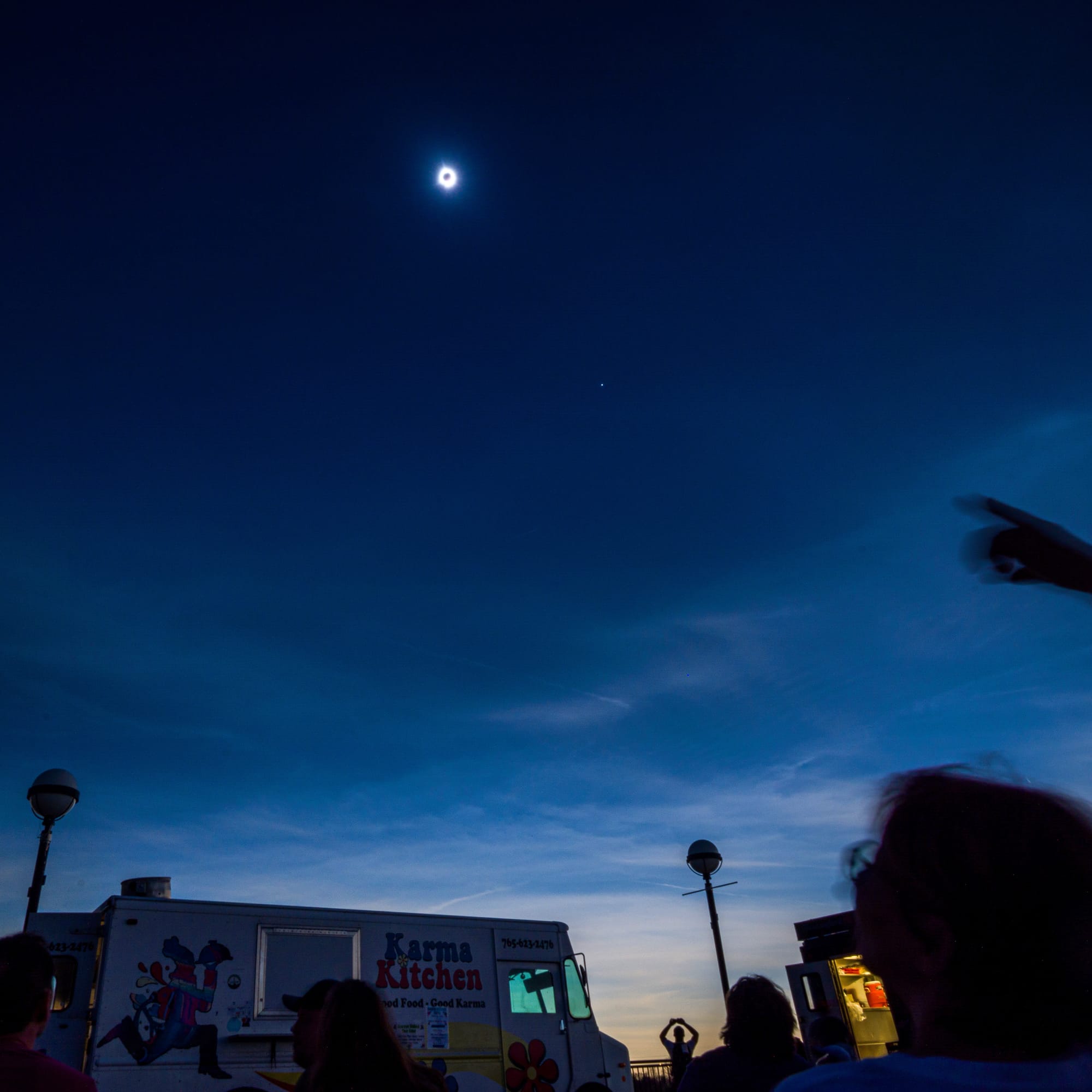 A total eclipse darkens the sky to dusk. 