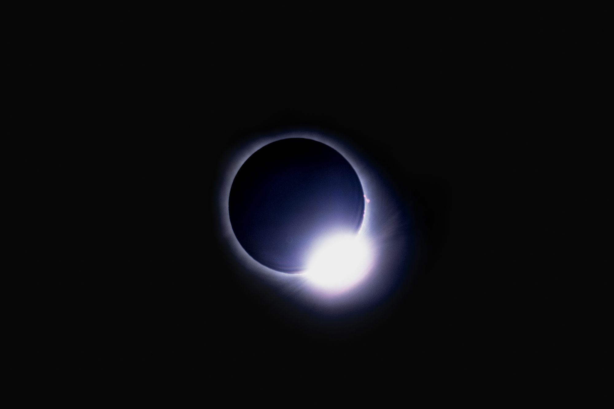The "diamond ring" of the solar eclipse, a flare of light seen at the bottom right corner