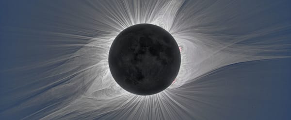 The streaming corona of the sun is visible during a total eclipse. 